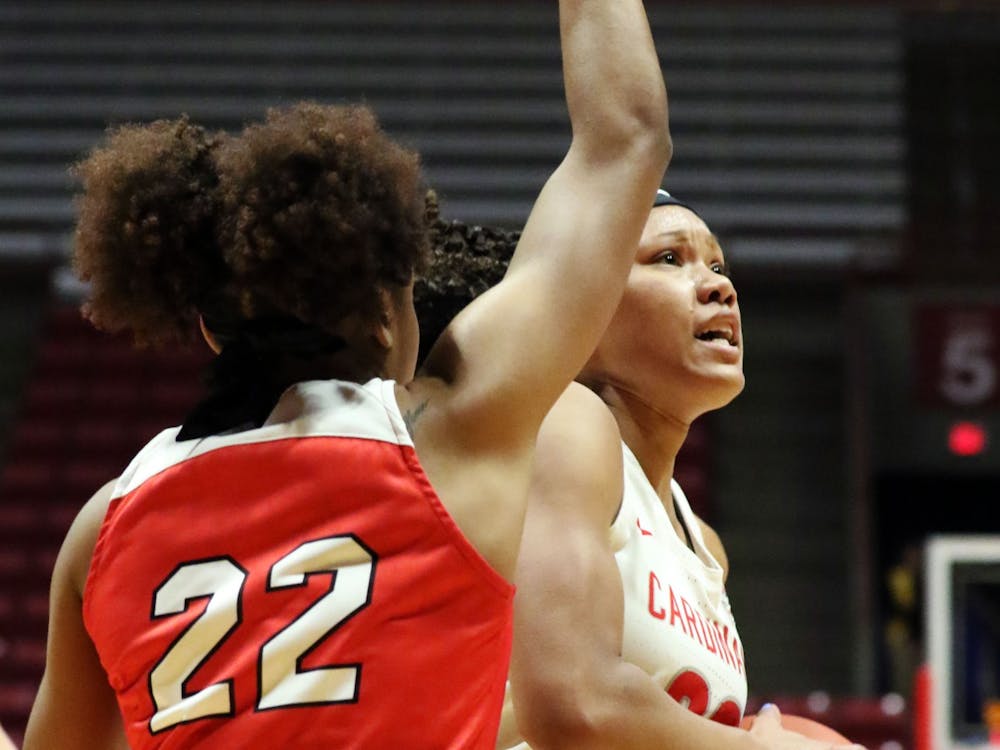 Ball State junior forward Oshlynn Brown drives the ball in while being guarded by Western Kentucky junior guard Sherry Porter during the Cardinals' game against the Hilltoppers Dec. 7, 2019, at John E. Worthen Arena. Brown was Ball States leading scorer with 22 points. Paige Grider, DN&nbsp;