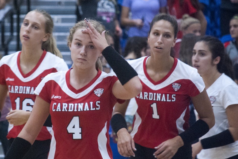 Freshman Hanna Smith (4) and senior Mackenzie Kitchel (1) run off the court after dropping a five-set match to Fort Wayne. The Cardinals kicked off their season with three losses in the Fort Wayne Invitational. COLIN GRYLLS//DN