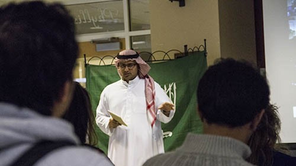 Graduate student Fahad Aseery talks to students Wednesday afternoon about Saudi Arabia in the Rinker Center for International Programs. Aseery presented on Saudi Arabia about different perspectives of the culture. DN PHOTO EMMA FLYNN