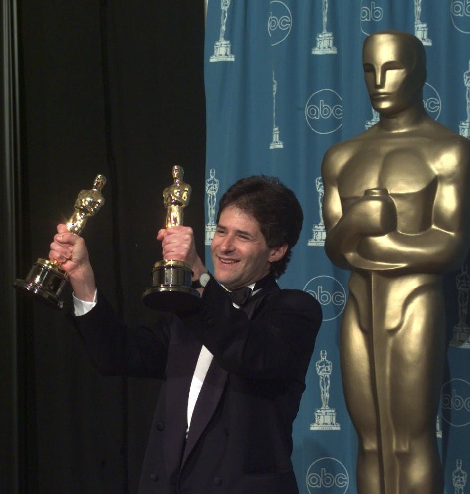 KRT ENTERTAINMENT STORY SLUGGED: OSCARS KRT PHOTOGRAPH BY MATTHEW J. LEE/LONG BEACH PRESS-TELEGRAM (KRT245) LOS ANGELES, California, March 23 -- James Horner  holds his Oscar for the song "My Heart Will Go On" from "Titanic" at Monday at the 70th Academy Awards in Los Angeles, California. (LB) PL, RTR, BL (jak20045) 1998 (COLOR) --NO MAGS, NO SALES-- (Editor's Note: Image Made With Digital Camera.)