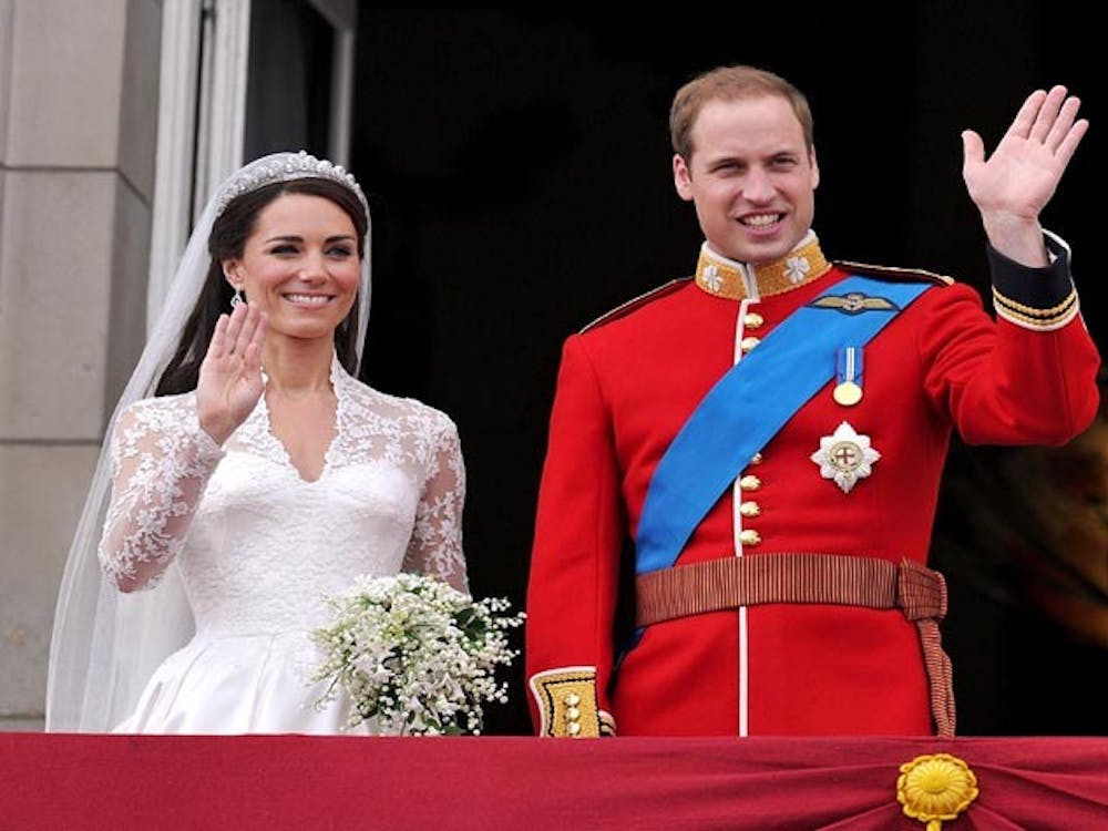Prince William and  Kate Middleton wave to the crowd from a balcony at Buckingham Palace after  their wedding in London, England, on Friday, April 29, 2011. (Abaca Press/MCT)