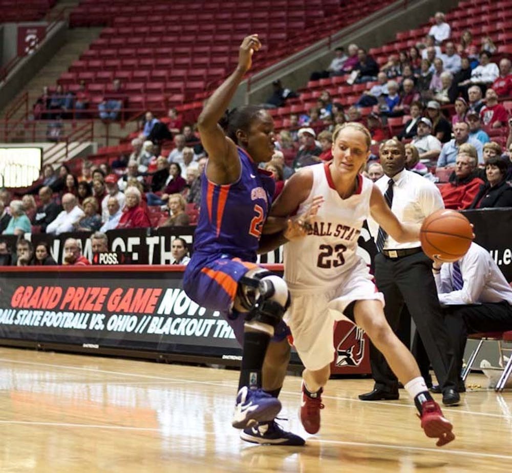 Sophomore guard Brittany Carter attempts to push past the Evansville defense on Nov. 9. The women’s basketball team will host IPFW at 7 tonight before a four-game road trip. DN FILE PHOTO JONATHAN MIKSANEK