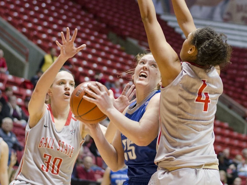 Freshman forward Shelby Merder and sophomore guard Nathalie Fontaine try to block a Buffalo player in the first half Jan. 26 at Worthen Arena. DN PHOTO BREANNA DAUGHERTY