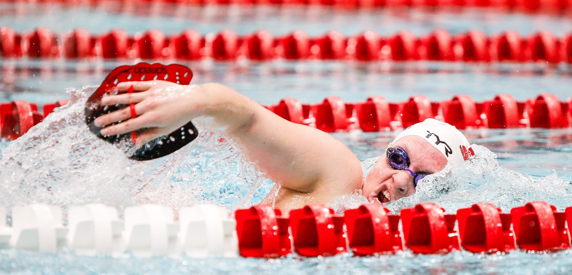 Freshman Alexa Von Holtz swims freestyle with a resistance flipper Feb. 16 during practice at Lewellen Aquatic Center. Von Holtz earned 16 event wins to end her regular season. Andrew Berger, DN 
