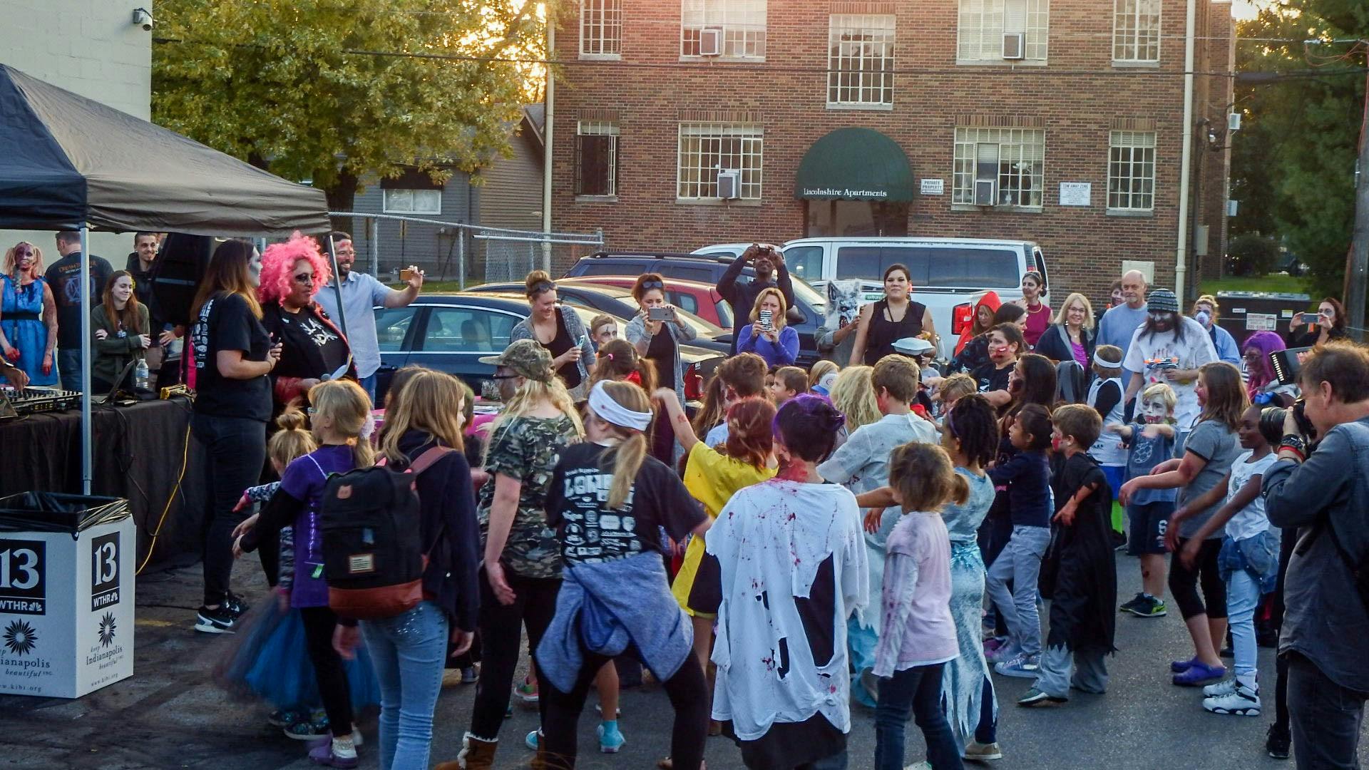 Zombies have been a cultural phenomenon ever since George Romero’s Night of the Living Dead &nbsp;first frightened audiences in 1968. While by no means the first example &nbsp;of a “zombie-like” creature in film, Romero is largely responsible for &nbsp;the modern zombie we all known and love today. These mindless, brain &nbsp;eating monsters are surely frightening, but who knew they could also &nbsp;allow for a night of fun and community service?
Every October across the world groups of people organize zombie &nbsp;walks. What exactly is a zombie walk? It is essentially a mob of people &nbsp;who come together dressed as zombies to lumber across town simulating a &nbsp;horde. Often, these events resemble pub crawls or organized flashmobs. &nbsp;According to a CBC interview with Sarah Lauro, a professor who studied zombies at Clemson University and author of The Transatlantic Zombie: Slavery, Rebellion, and Living Death, &nbsp;the trend started in Toronto in 2003, but later became popular in 2005 &nbsp;as a result of the Iraq war and the subsequent cultural upset. In short, &nbsp;zombies became a sort of catharsis for the public.
Lauro speaks about the cathartic effect zombies have:
“And the facts are there that, when we are experiencing economic &nbsp;crises, the vast population is feeling disempowered. … Either playing &nbsp;dead themselves … or watching a show like Walking Dead provides a great variety of outlets for people.”
So basically zombies can help society through some rough patches. &nbsp;With this explanation of why zombies are so popular in mind, let’s take a &nbsp;look at these zombie walks in a bit more detail. With this in mind, &nbsp;Lauro gives us a glimpse at the magnitude of zombie walk events:
“As of [2012]… zombie walks had been documented in 20 countries. The &nbsp;largest gathering drew more than 4,000 participants at the New Jersey &nbsp;Zombie Walk in Asbury Park, N.J., in October 2010, according to Guinness &nbsp;World Records.”
Dressing up and walking around as zombies sounds great, but is there &nbsp;really a point to it other than blowing off some steam? Well yes! Other &nbsp;than allowing for a great time, many zombie walks serve as fundraisers &nbsp;for nonprofit organizations.
An example of such a zombie walk happens annually in Indianapolis. &nbsp;Taking place Saturday October 21, the Broad Ripple Zombie Walk returned &nbsp;for its 12th year.
Okay so people walk around dressed as zombies, but what else? While &nbsp;the undead parade happens later at night, there are other activities for &nbsp;zombie walkers and spectators to partake in while waiting. Notably, a &nbsp;large makeup table run by staff from Tricoci University of Beauty &nbsp;Culture. With plenty of costume accessories such as fake blood, bite &nbsp;marks, and pieces of “flesh” on hand, attendees were able to become &nbsp;zombified in a matter of minutes.
For an event focused on brain eating monsters, Broad Ripple Zombie Walk offers plenty of family friendly activities. Other than the makeup booth on hand for children to transform themselves into freaky zombies, volunteers host carnival games for children to partake in and even win prizes.
While celebrating guts and gore is always a good time, the Broad Ripple Zombie Walk serves a more important purpose as a fundraiser to benefit Gleaners Food Bank.
According to the event’s official Facebook page, “The Broad Ripple Zombie Walk had over 1000 zombies and collected 4,500lbs of canned food.” During last year’s event, the Indy Star Reports that “The Broad Ripple Zombie Walk had more than 800 zombies and collected 3,500 pounds of canned food. Organizers have raised the goal to 5,000 pounds this year.” The amount of participants and food collected indicates that a zombie walk is definitely an effective way to host a fundraiser.
It may seem a bit strange that zombies, creatures known for violence and destruction can go hand in hand with altruistic ideals. With the popularity of shows like The Walking Dead and movies like World War Z, the zombie trend has infected the mainstream media and boosted zombies into a cultural phenomenon. Capitalizing on the popularity of these creatures is a sure-fire way to help communities in a fun, unique way. The Broad Ripple zombie walk is not an isolated case of this type of unconventional fundraising. These types of events happen often around Halloween and are often largely successful. Who knew zombies could be so helpful?
Zombies are staples of Halloween, mainly because they’re freaky, gross monsters. However, instead of coming together to destroy communities, as they do so often in horror media, these zombies are coming together to lift communities up.