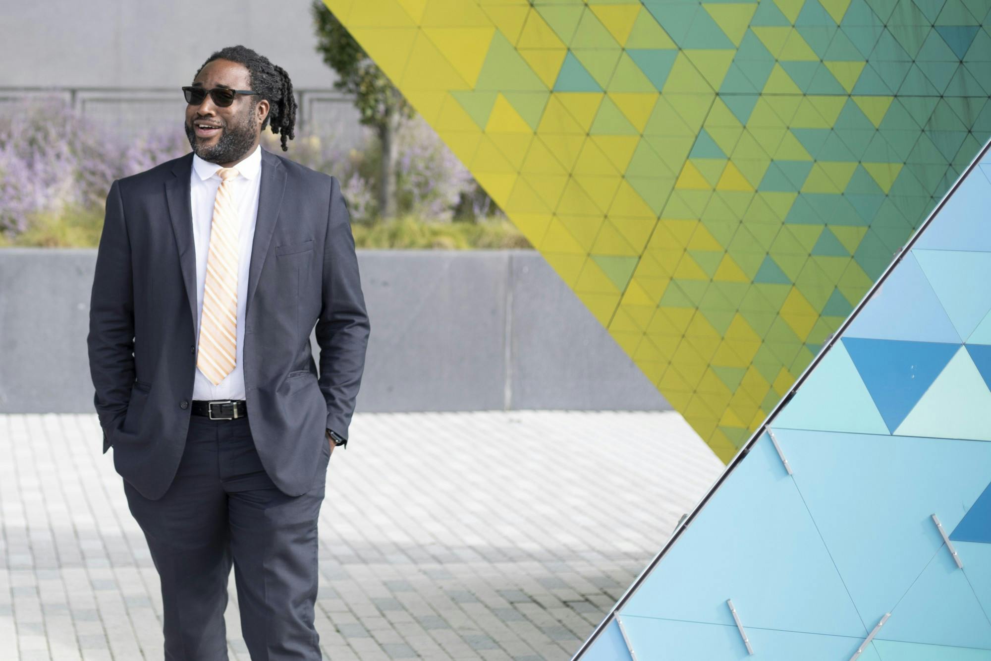 Lourenzo Giple, Indianapolis deputy director of planning, preservation and design walks around a sculpture in Lugar Plaza Sept. 21, in Indianapolis. Giple is also an adjunct professor of urban design at Ball State. Jacob Musselman, DN