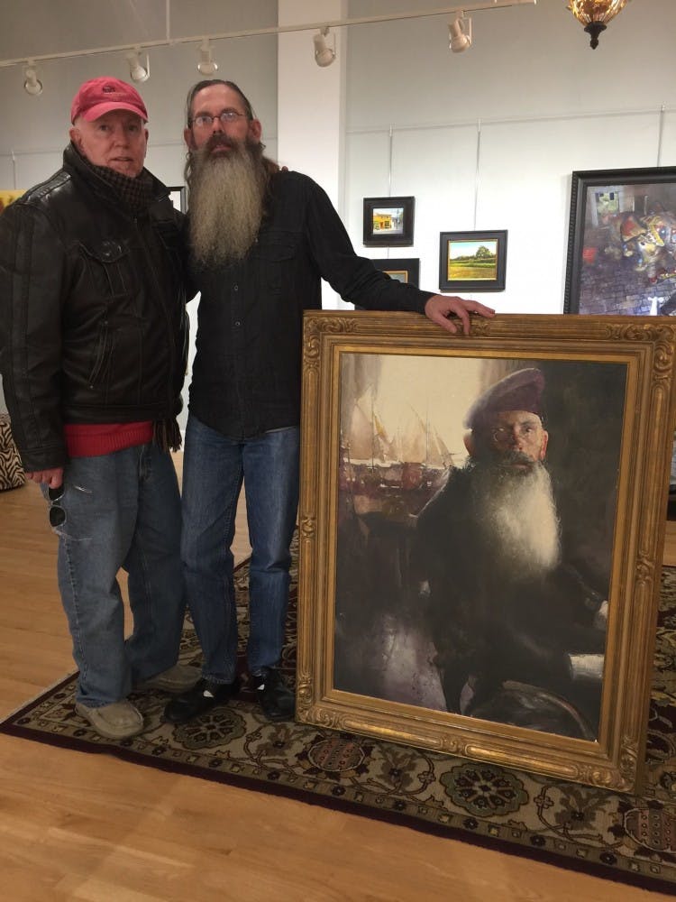 C. W. Mundy (left) poses with Richard Anderson (right)&nbsp;next to Mundy's portrait of Anderson.&nbsp;