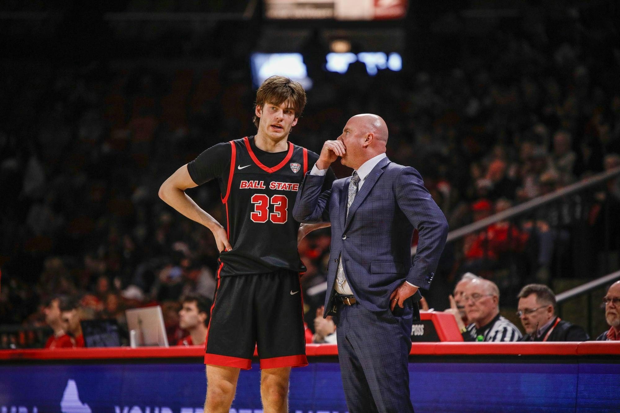 Freshman guard Mason Jones talks to coach Micheal Lewis during a free throw against Miami Feb. 17 at Millet Hall. Jones had two total points in the game. Andrew Berger, DN 