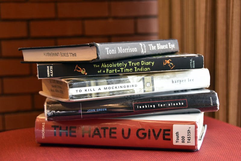 Books that are popularly known for being banned stacked on Sept.29 in Bracken Library. "Eleanor Park,” "Gender Queer: A Memoir" and “The Perks of Being a Wallflower,”are not pictured, as they were checked out or not owned by the library. Ella Howell, DN