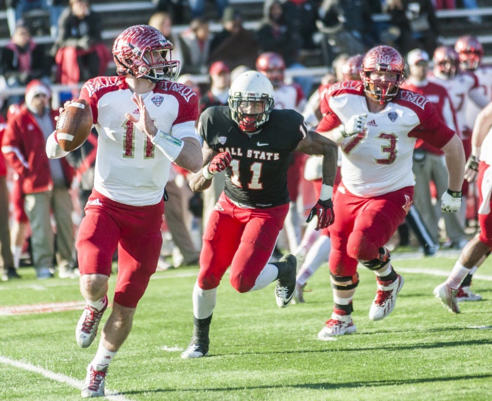 Senior defensive end Jonathan Newsome attempts to sack Miami's Austin Gearing on Nov. 29. DN PHOTO JONATHAN MIKSANEK