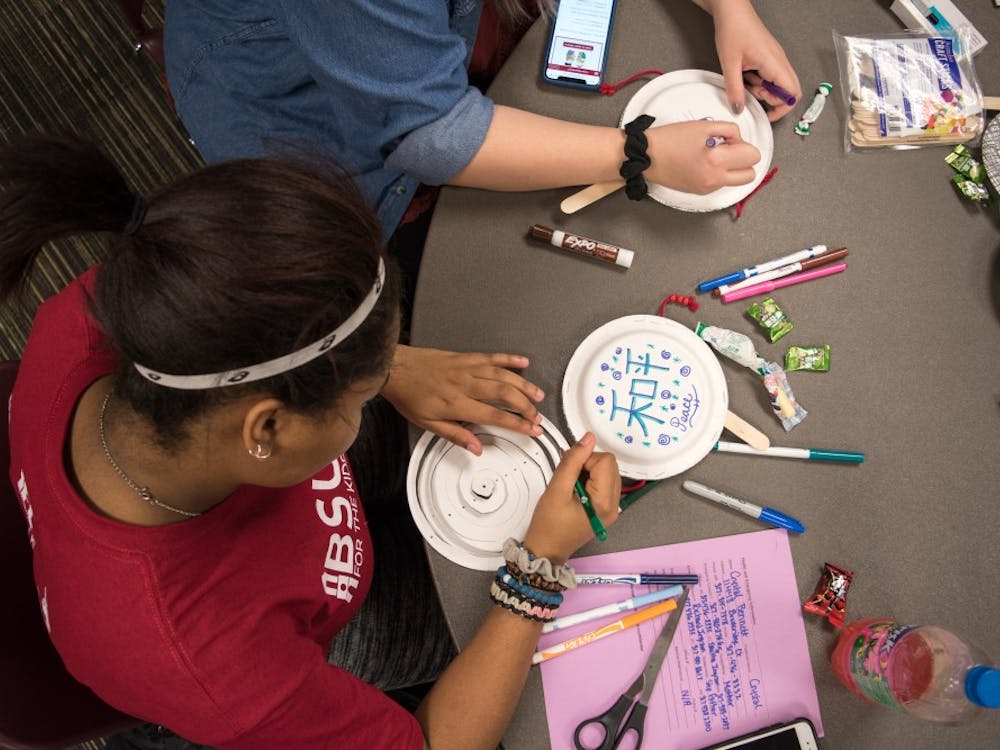 Freshman Crystal Bennett, medical technology major, decorates a plate drum to celebrate Lunar New Year on Feb. 19 at the L.A. Pittenger Student Center. Student decorate plate drum sticks for Lunar New Year 2018 to celebrate the year of the Dog at American Asian Student Association event. Stephanie Amador, DN