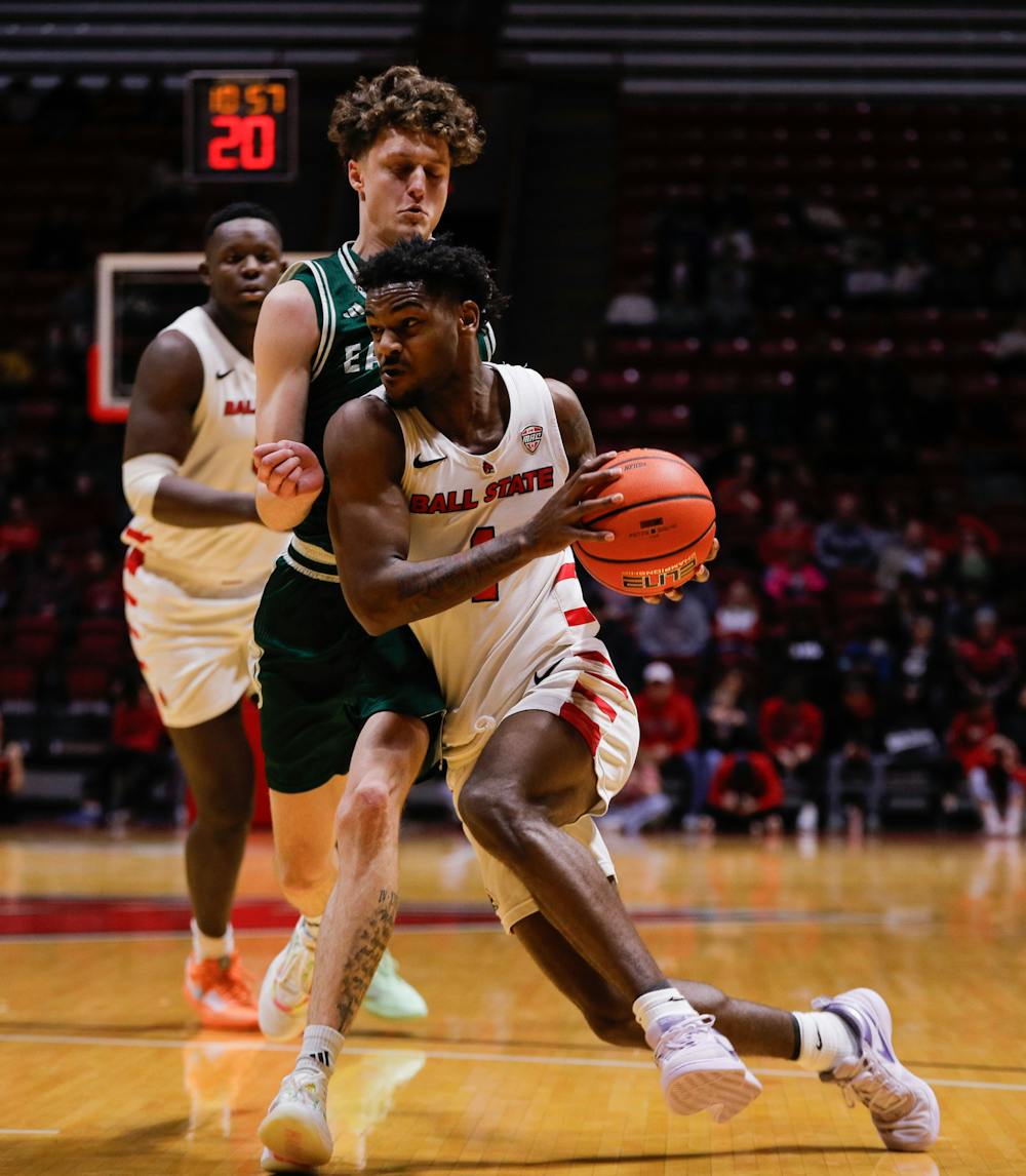 Ball State junior guard Jermarhi Hill drives with the ball against Eastern Michigan Feb. 11 at Worthen Arena. Hill had three personal fouls in the game. Andrew Berger, DN 