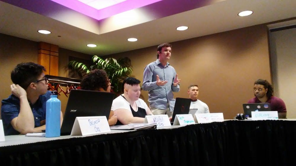 <p>Senator James Schwer talks with senate regarding a resolution to change rules for electing a President Pro-Tempore. &nbsp;SGA approved a resolution changing the recommended number of justices on the student judicial court on March 20, 2019 at the L.A. Pittenger Student Center. <strong>Charles Melton, DN</strong></p>