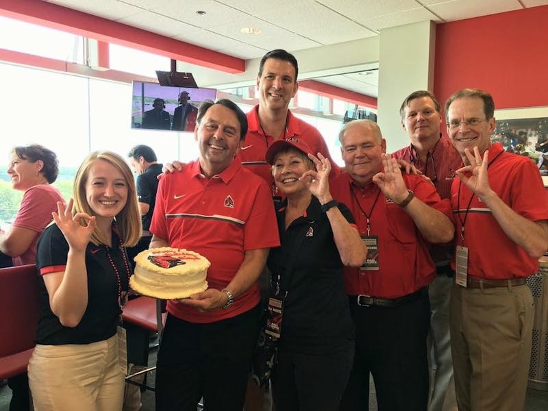 Board of Trustees members (from left)&nbsp;Marlee Jacocks, Wayne Estopinal, Chair Rick Hall, Jean Ann Harcourt, Mike McDaniel, Tom Bracken and President Geoffrey Mearns celebrate Estopinal's birthday at a home football game in the fall of 2017. Estopinal was not only active in the university through the Board of Trustees, but was also an active alumnus in the College of Architecture and Alumni Council. Marlee Jacocks, Photo Provided&nbsp;