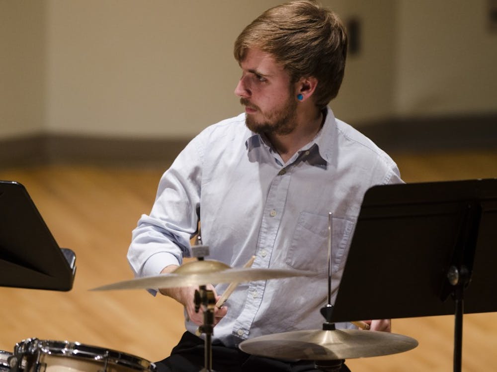 Percussionist Tyler Thom plays the drums on May 1 with the Brazilian Ensemble at John J. Pruis Hall. The coordinator of the Ensemble was Bruno Carera, who arranged the music. Stephanie Amador // DN 