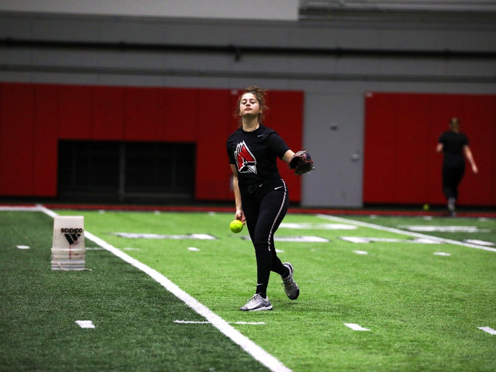 Sophomore pitcher Bridie Murphy pitches the ball during a practice Jan. 26 at Scheumann Family Indoor Practice Facility. Murphy had a 4.76 earned run average while pitching for the 2023 season. Mya Cataline, DN 