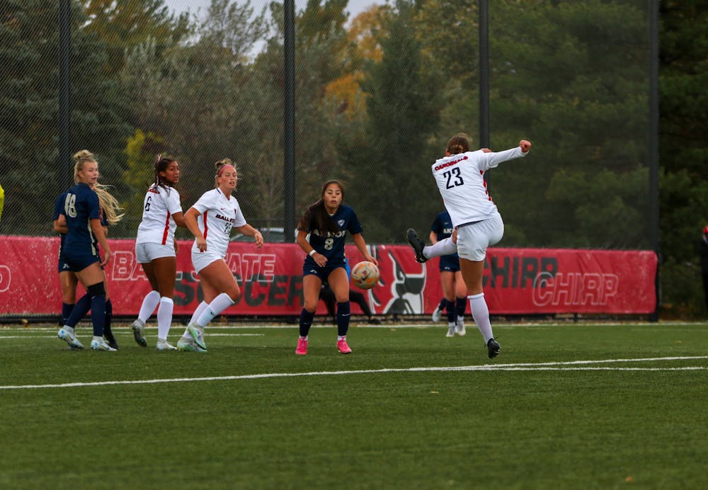 <p>Third-year defender Abby Elgert makes a shot on goal in the second half of the game against Akron on Oct. 13 at Briner Sports Complex. Elgert kicked a total of three shots during the game. Eve Green, DN</p>