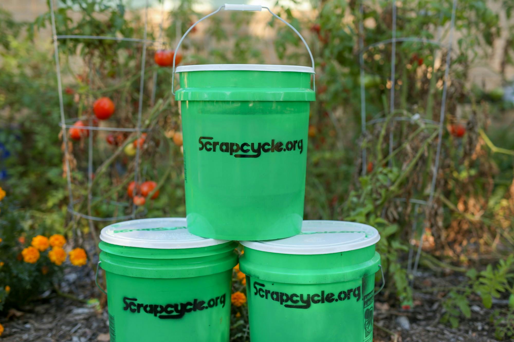 Green ScrapCycle buckets sit in a pyramid in Muncie, Indiana. The composting program is volunteer-based and people who want to participate can sign up online and receive their own bucket within two weeks. Bob Mattax, Photo Provided