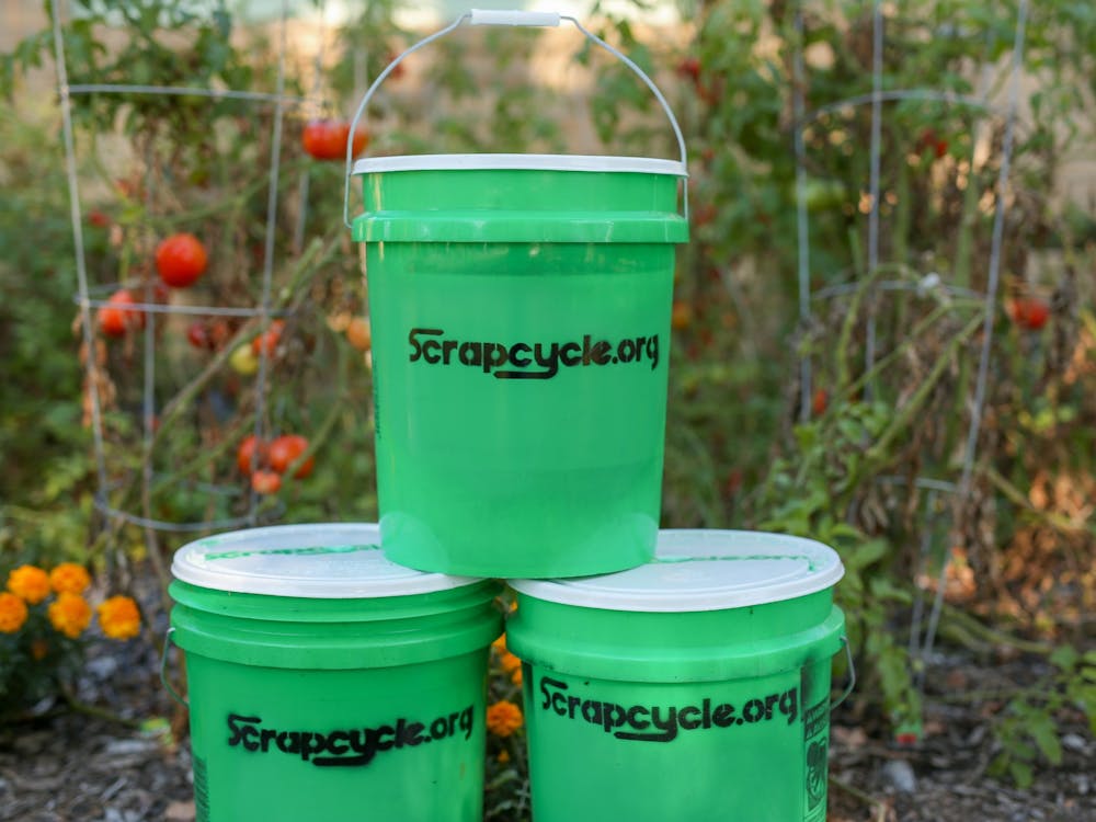 Green ScrapCycle buckets sit in a pyramid in Muncie, Indiana. The composting program is volunteer-based and people who want to participate can sign up online and receive their own bucket within two weeks. Bob Mattax, Photo Provided