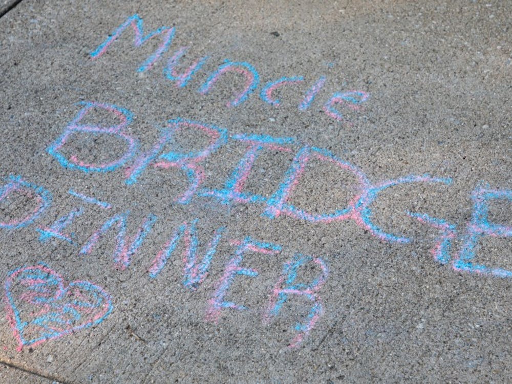 Chalk art drawn on the sidewalk at the Muncie Bridge Dinner Sept. 20 on the Washington St. Bridge. The annual Muncie Bridge Dinner had both food and music for participants. Chase Martin, DN.