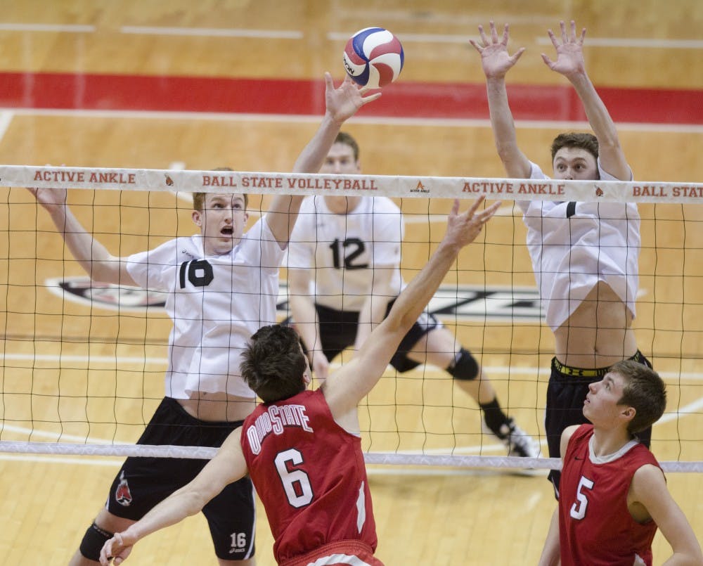 Senior middle attacker Kevin Owens and junior outside attacker Shane Witmer try to block the ball in the third set against Ohio State on March 23 at Worthen Arena. DN PHOTO BREANNA DAUGHERTY