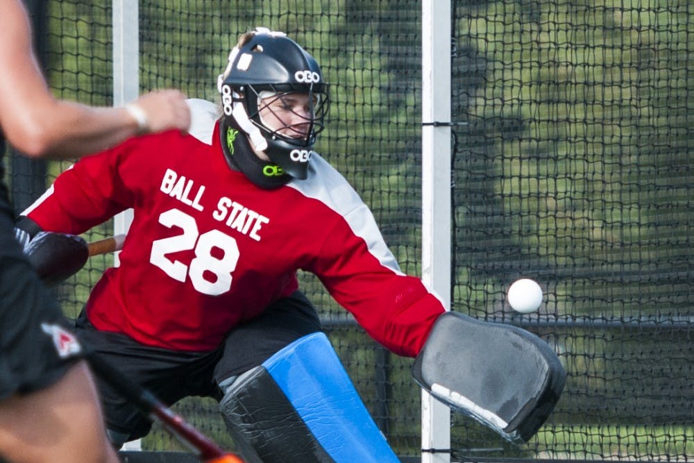 Junior goalie Shelby Henley blocks the Indiana University shot during the game on Sept. 17 at the Ball State turf field. DN PHOTO JONATHAN MIKSANEK