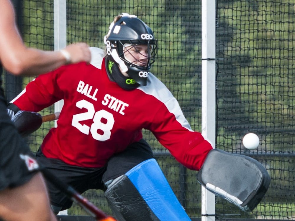 Junior goalie Shelby Henley blocks the Indiana University shot during the game on Sept. 17 at the Ball State turf field. DN PHOTO JONATHAN MIKSANEK