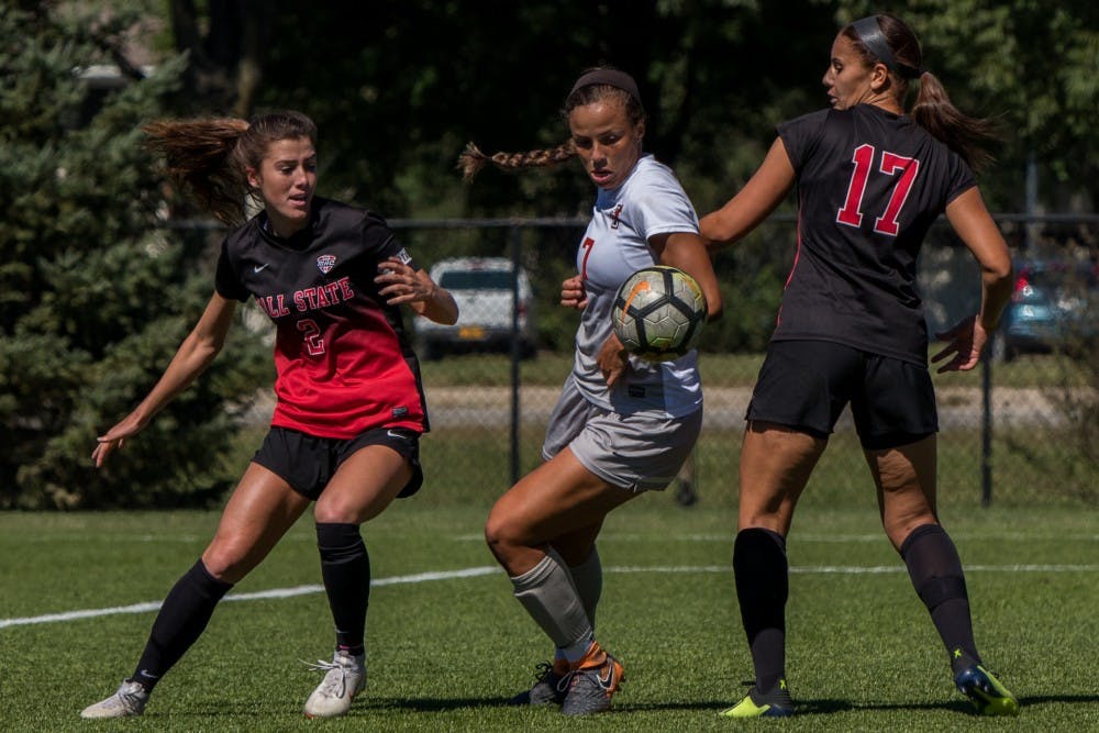 Bowling Green midfielder Chelse Washington kicks the ball past midfielders Lauren Roll and Julia Elvbo to drive in towards Ball States' goal Sept. 23, 2018, at Briner Sports Complex. Ball State was defeated 0 to 3. Eric Pritchett,DN