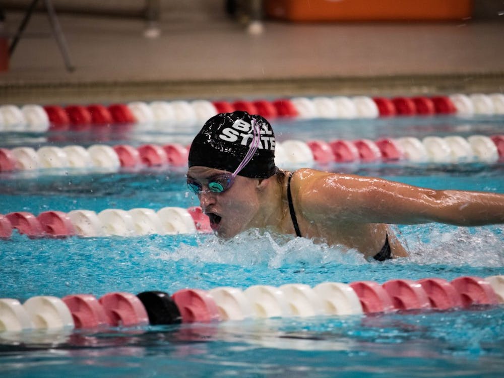 Senior Andrea Richter finishes the 400 Medley Relay during the meet against Ohio on Oct. 28 at Lewellen Pool. The Cardials lost 114-185. Rebecca Slezak, DN.