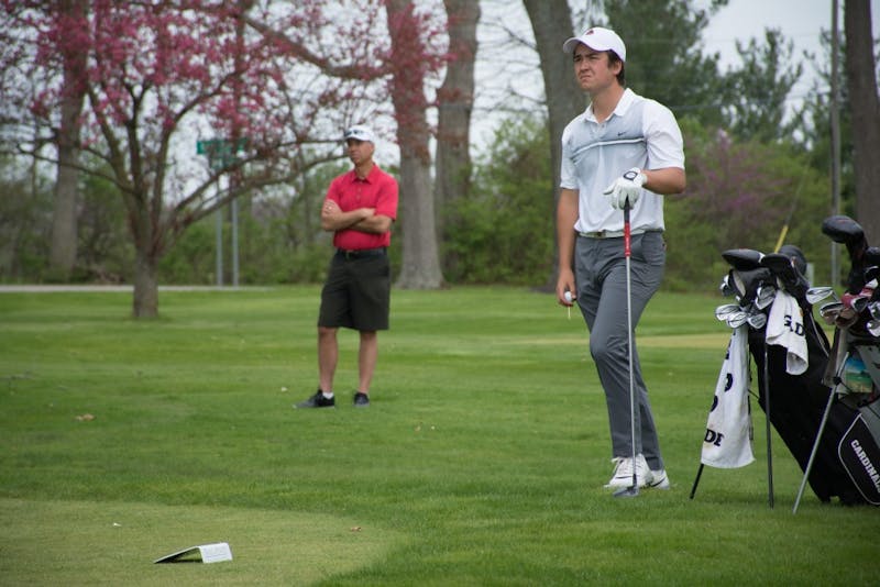 Senior Johnny Watts waits his turn to hit the ball at the start of hole 12 during the Earl Yestingsmeier Memorial Invitational on April 14 at the Delaware Country Club. The Cardinals placed second at the invitational. Kaiti Sullivan, DN