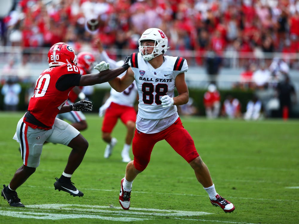 Sophomore tight end Tanner Koziol tries to get around a player against Georgia Sept. 9 at Sanford Stadium in Athens, Ga. Mya Cataline, DN