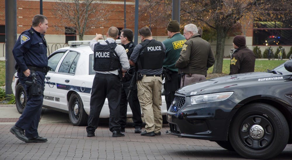Police secure the Student Recreation and Wellness Center after a report of an armed assailant in the rec center. DN PHOTO TAYLOR IRBY