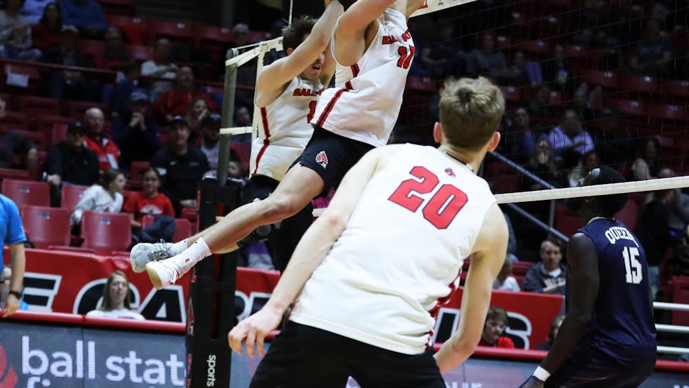 Senior middle blocker Rodney Wallace blocks the ball against Queens March 1 at Worthen Arena. Wallace scored seven points in the game. Mya Cataline, DN