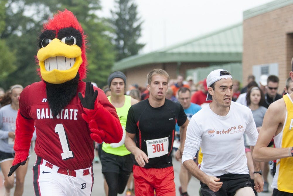Charlie Cardinal takes off from the starting line with the other runners during the Chase Charlie 5K Fun Run on Sept. 13. Over 150 people participated in this year's run. DN PHOTO JORDAN HUFFER