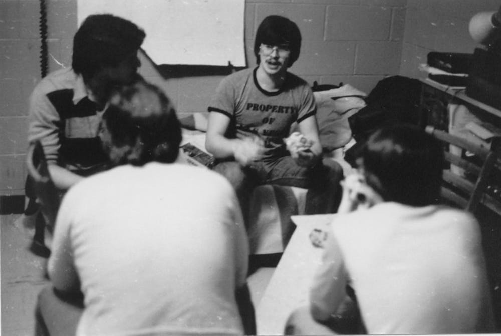 <p>Alumnus Jolly Blackburn sits in his dorm room with his friends. Blackburn draws a comic, "Knights of the Dinner Table," based on his experiences at Ball State. PHOTO PROVIDED BY JOLLY BLACKBURN</p>