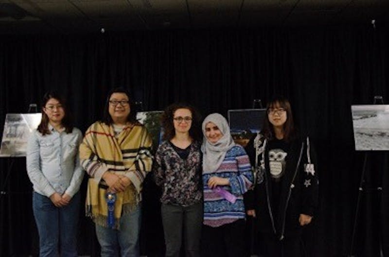 Five of the six winners of the International Photo Contest pose for photos after the ceremony Nov. 16, 2018. All of the submitted photos fell into three categories: Best Indiana Experience, International Culture and Places and U.S. sightseeing. Kamryn Tomlinson, DN.