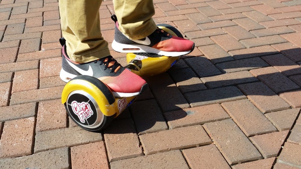 Recently, hoverboards, as they’re commonly referred to, have been showing up around campus and are being sold by the people who organize ChirpFest. The boards operate like a Segway, but lack the pole. DN PHOTO ALEXANDRA SMITH