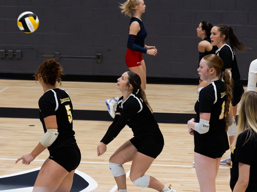 Junior Eowyn Glaze warms up before the game. Glaze continued to warm up through the beginning of the game at Cowan Jr/Sr. High school against the Blue River Valley Vikings on Oct. 10. (Photo by Kaylee Kern)