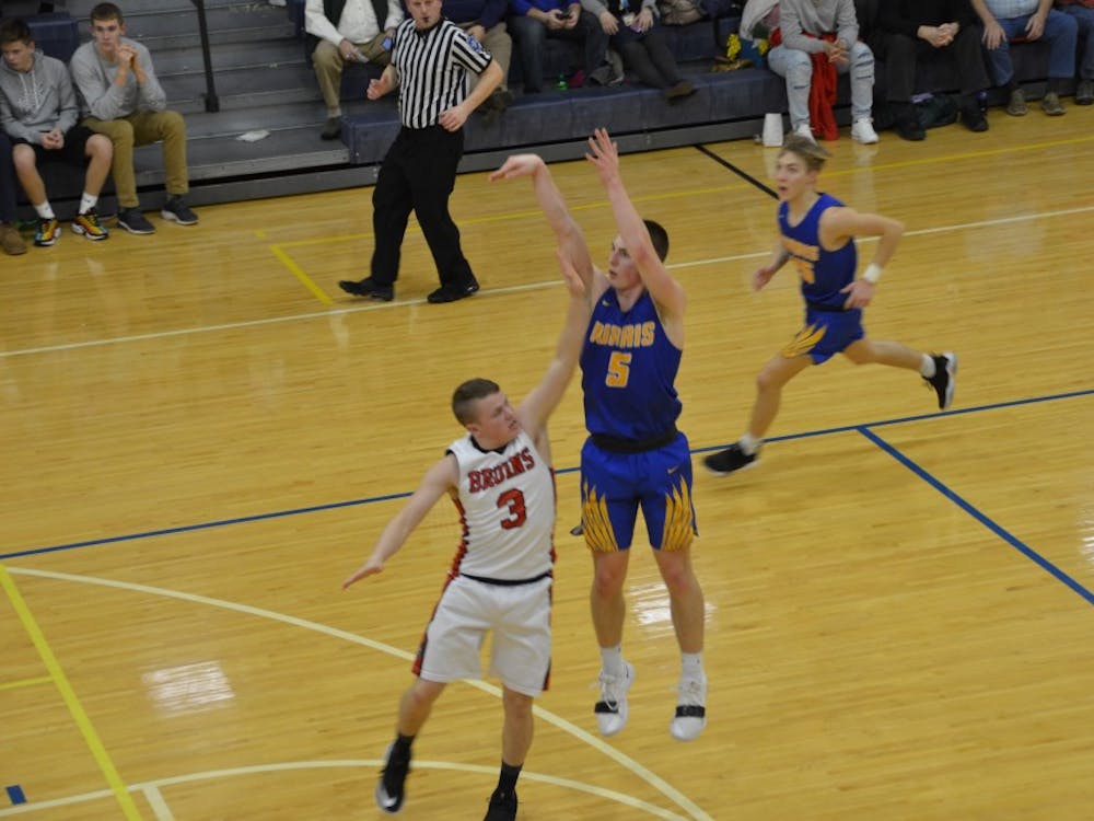 Burris senior Jackson Adamowicz shoots over a Blackford defender in a game against the Bruins on Feb. 21 at Ball Gymnasium. The Owls fell to the Bruins, 88-69. Jack Williams, DN&nbsp;
