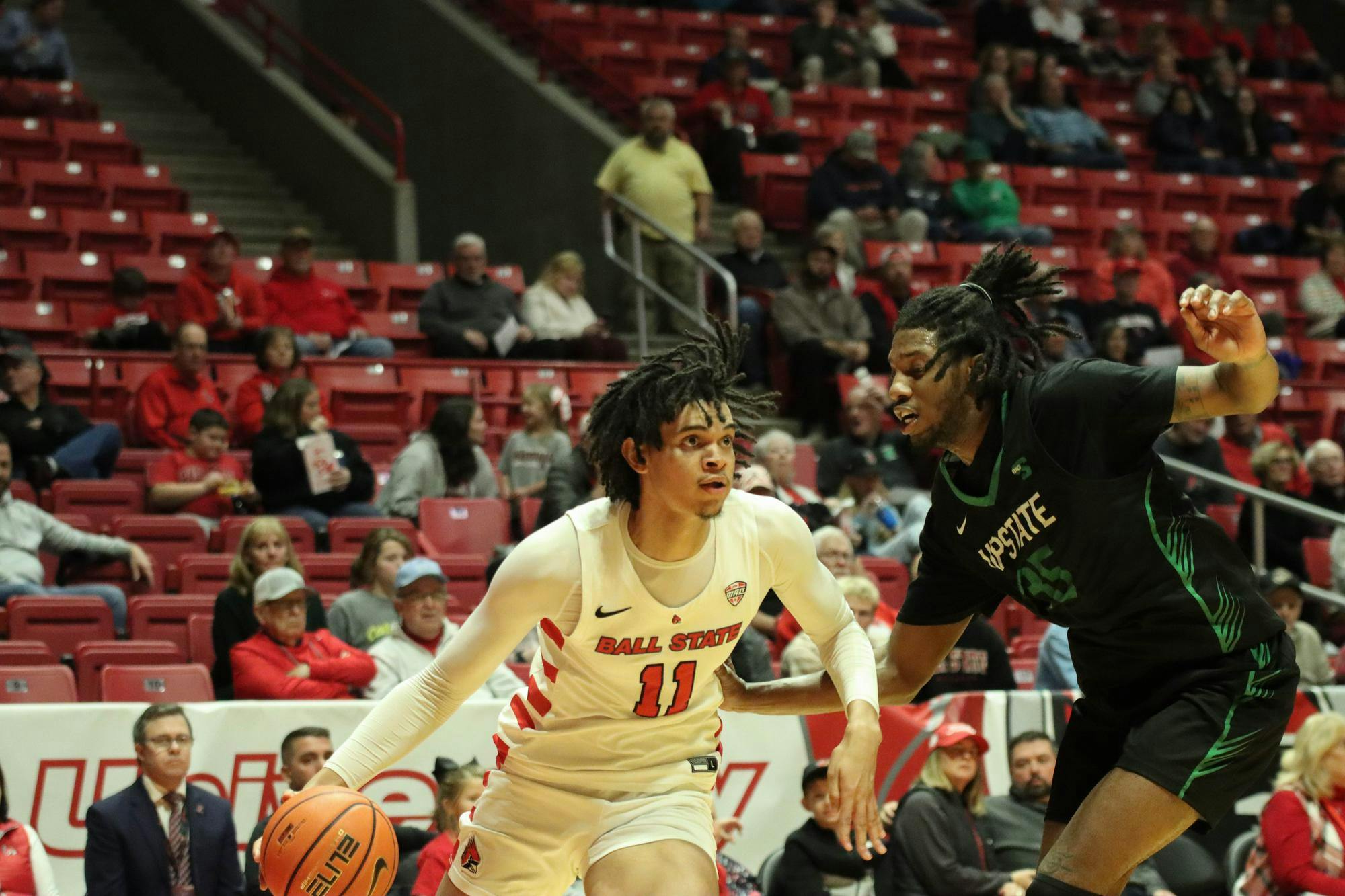 Junior forward Basheer Jihad circumvents the opposing team. Nov.21 against USC Upstate at Worthen Arena. Isaiah Wallace, DN
