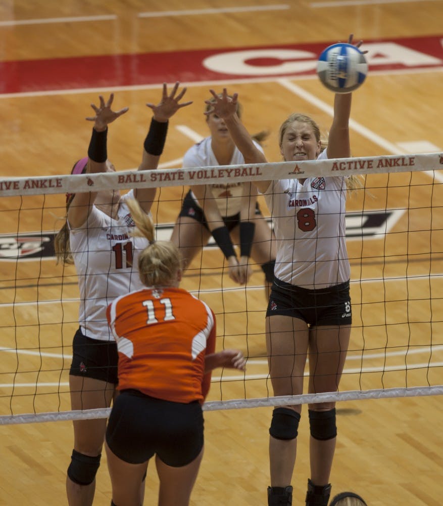 Senior middle hitter Mindy Marx jumps up for a block against Bowling Green State University on Oct. 25 at Worthen Arena. DN PHOTO MATT McKINNEY