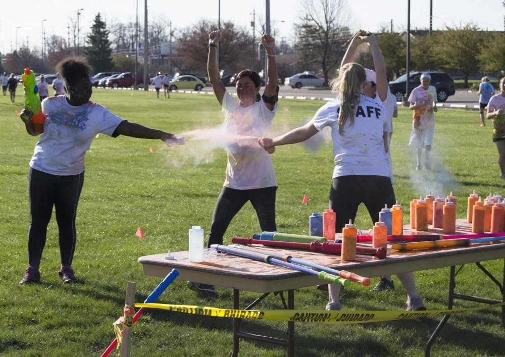 People participated in the 4th annual Chase the Rainbow 5K on April 16 at Bethel Field. Participants were colored with wet and dry paint throughout the course. DN PHOTO CURTIS SILVEY