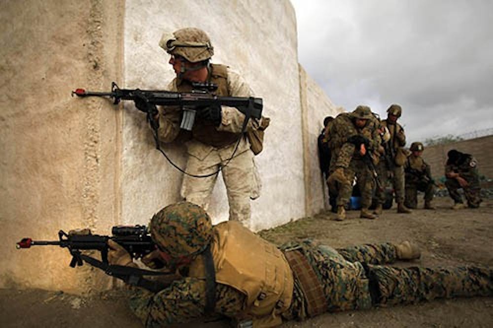 U.S. Marines run a training exercise in a fake village, built to simulate a real Afghan town, in Camp Pendleton, Calif., on Nov. 18, 2011. Seven Marines were killed in a training accident in Nevada on Monday after a mortar round exploded during a live fire exercise. MCT PHOTO