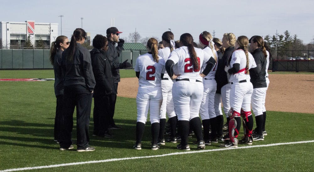 The Cardinals meet up with their coaches after their first win  against IPFW March 18 at the Softball Field at the First Merchants Ballpark Complex.  DN PHOTO MAKAYLA JOHNSON