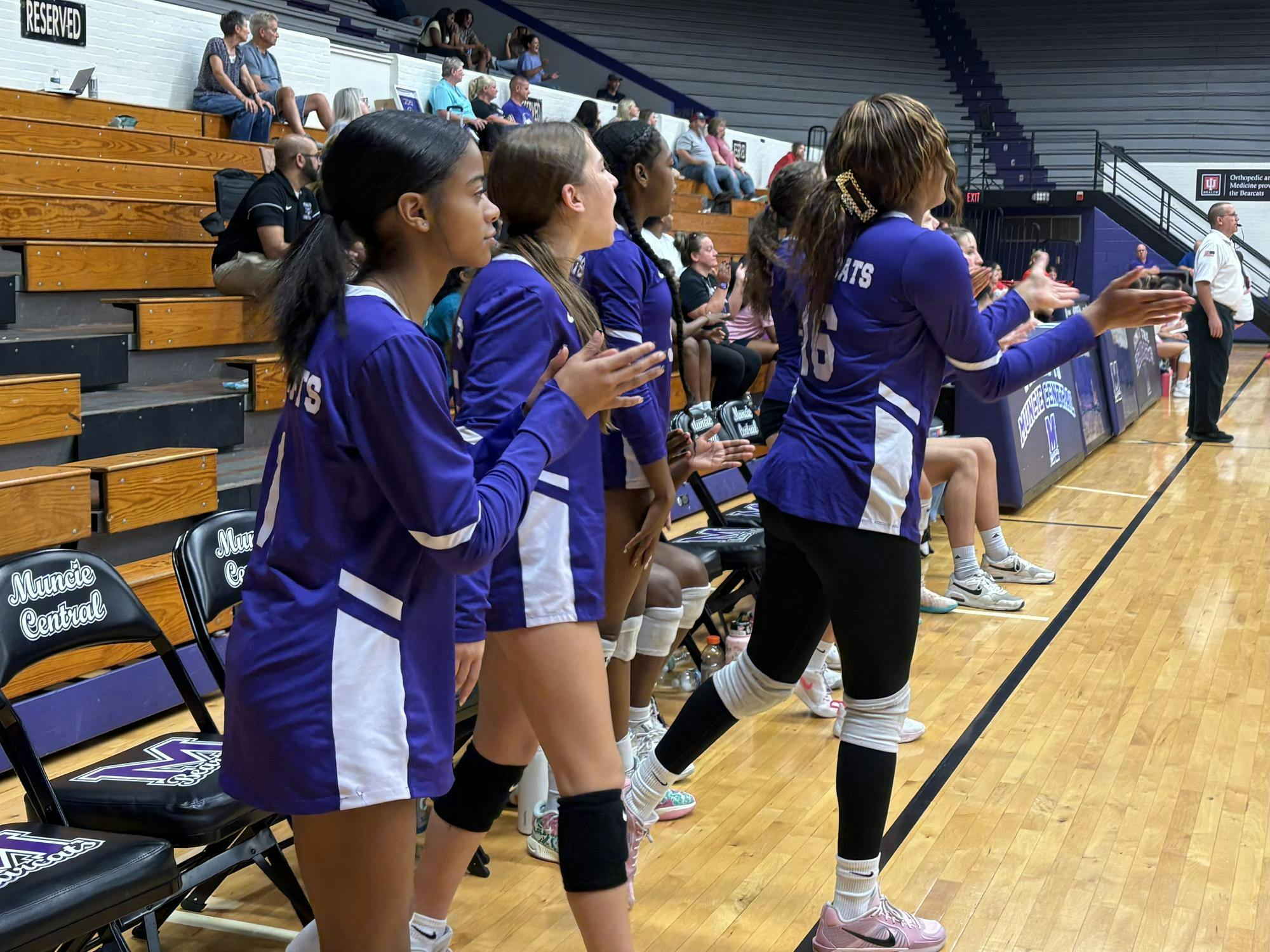 Bearcat teammates show support from the bench when Muncie Central earns a point. Junior Kendall Kahle earned a point for Muncie after spiking the ball for a kill against the Connersville Spartans on Sept. 30, 2025. PHOTO BY MADISON WARD.
