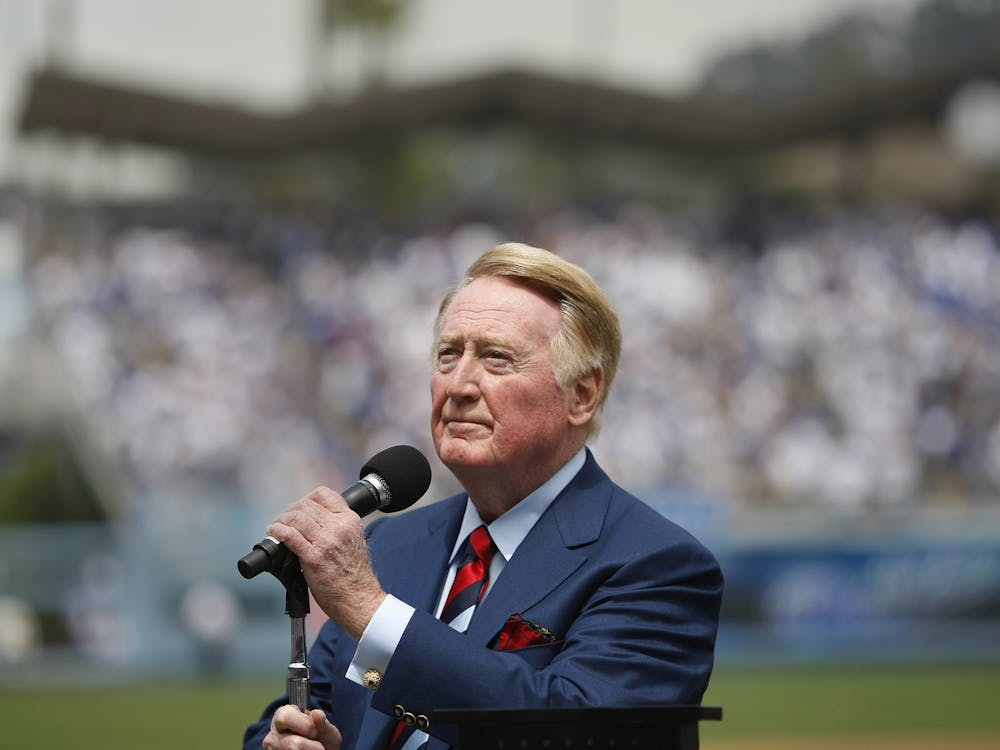Los Angeles Dodgers announcer Vin Scully looks into the stands before announcing "It's time for Dodgers baseball," before the team's season opener against the San Francisco Giants in April 2009. (Allen J. Schaben/Los Angeles Times/TNS)