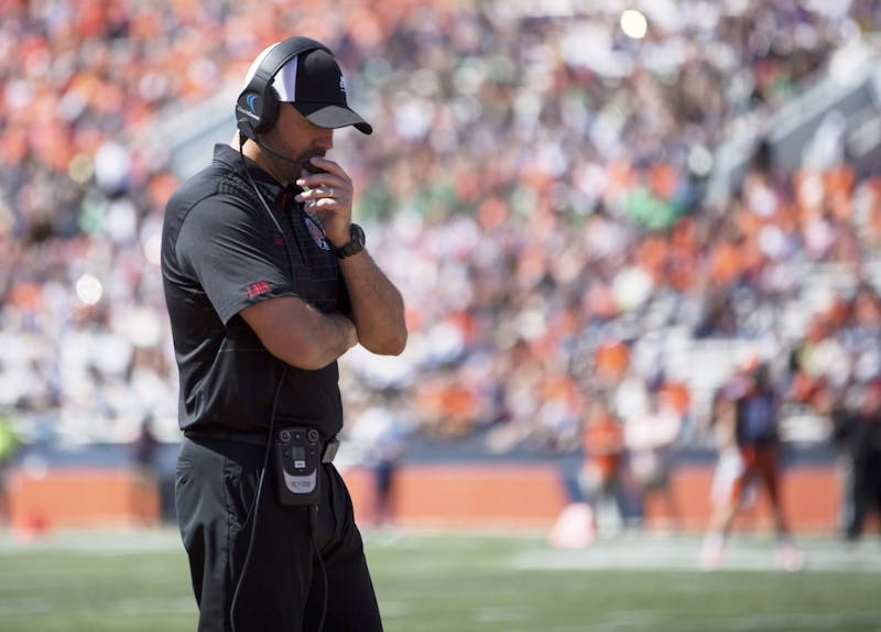 Ball State head coach Mike Neu walks down the sideline during the game against the University of Illinois on Sept. 2, 2017. Ball State lost to Illinois 24-21, bringing the Cardinals to 0-1 on the season. 