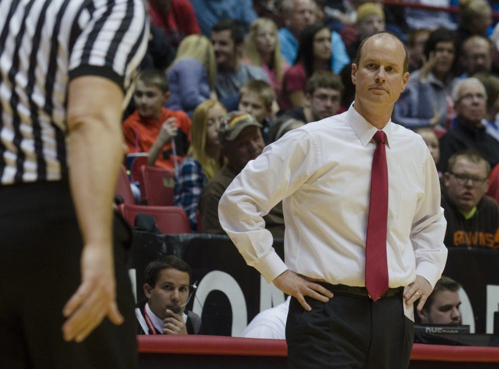 Head coach Brady Sallee reaches to a play that was called during the game against Purdue on Nov. 14 at Worthen Arena. DN PHOTO BREANNA DAUGHERTY