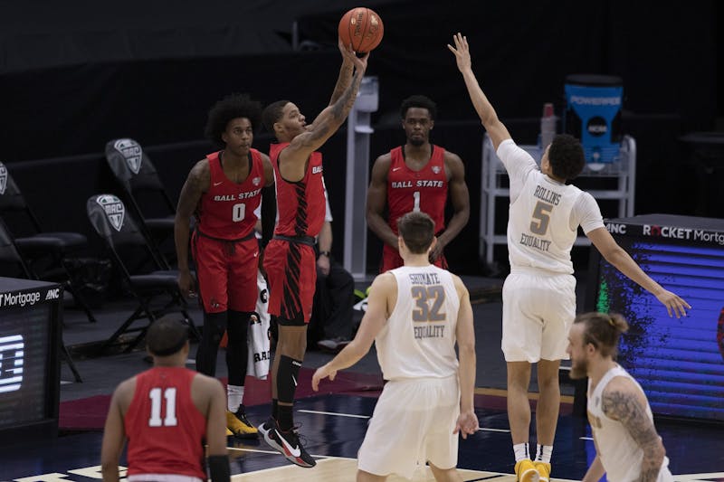 Cardinals senior guard Ishmael El-Amin shoots a three pointer during the second half of the quarterfinals game of the Mid American Conference Tournament against the Toledo Rockets March 11, 2021, at Rocket Mortgage Fieldhouse in Cleveland, Ohio. The Cardinals lose to the Rockets 91-89 in overtime. Jacob Musselman, DN