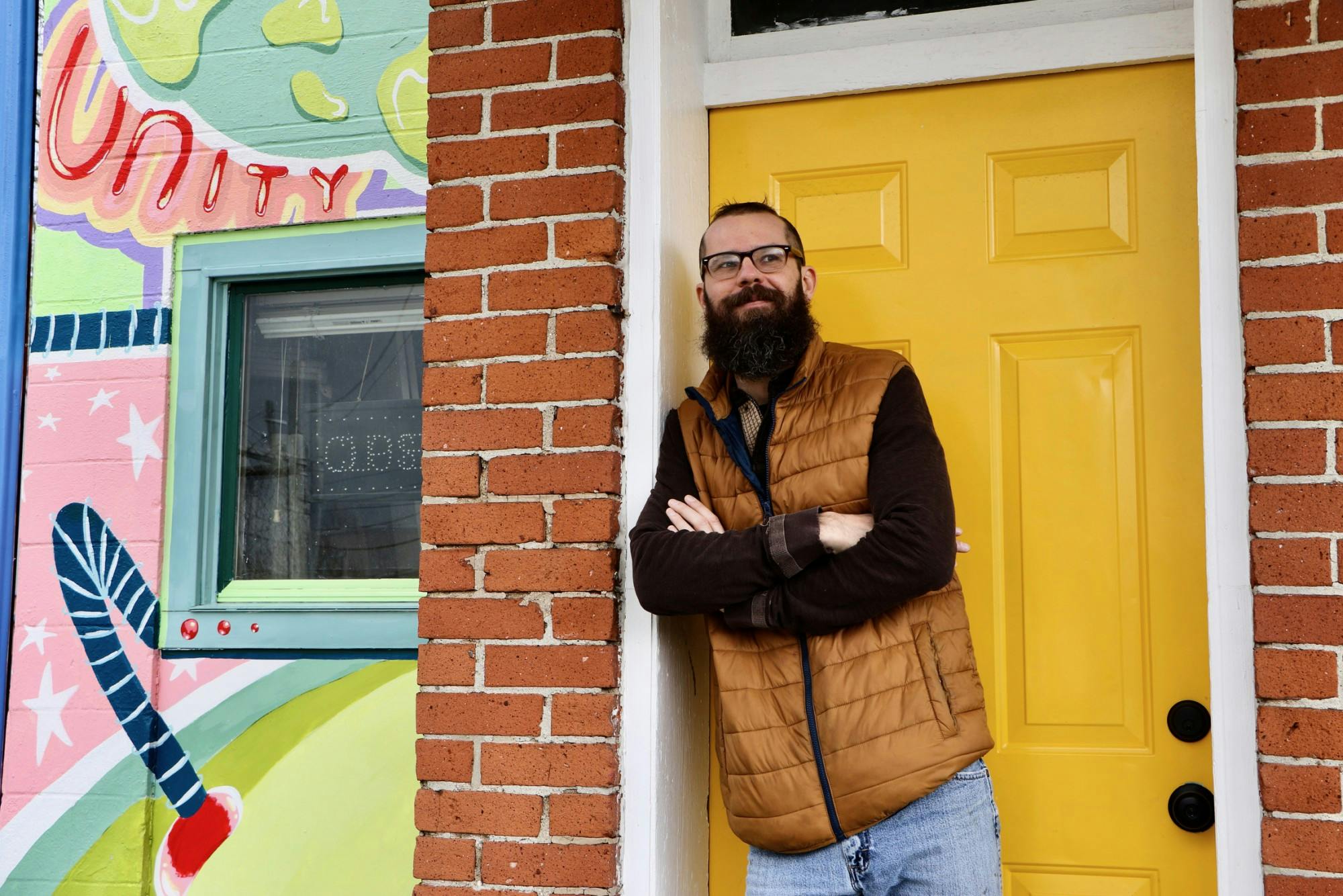 Kory Gipson, co-owner of The Common Market in Muncie, stands outside his storefront April 1. After purchasing the property in 2016, Gipson said his goal for the business is to strengthen his ties to the community. Grace Duerksen, DN
